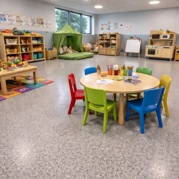 Childcare epoxy flooring Brisbane classroom with seamless, easy-clean epoxy floor by Epoxy Flooring Guys Brisbane.